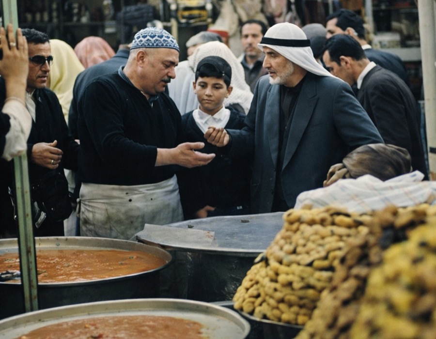 Father and son making knafeh together in the bakery kitchen