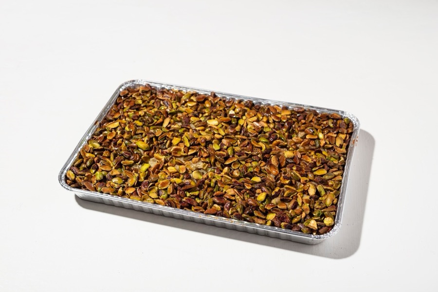 Syrian style Hareeseh Shamieh topped with fresh pistachio layer